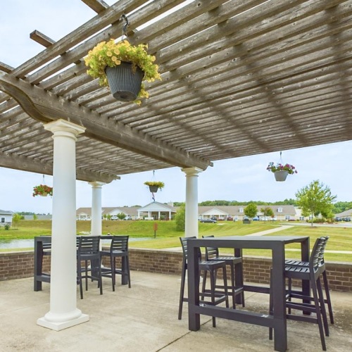 Enjoy our resident-only features a table and chairs under a covered area